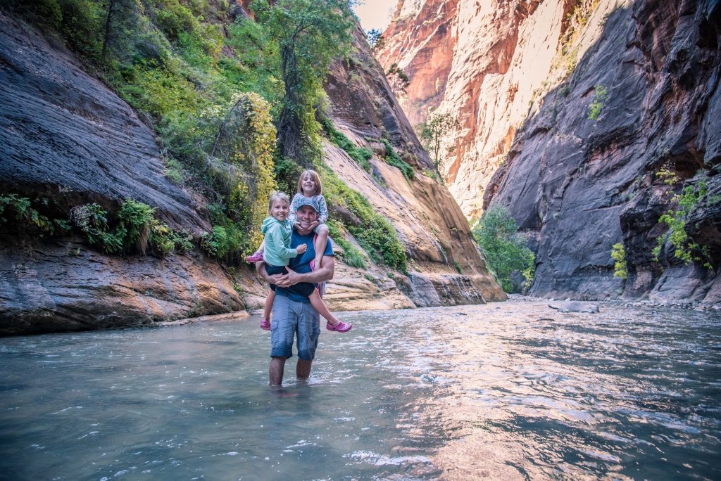 Travelling with kids sometimes means carrying them on a hike